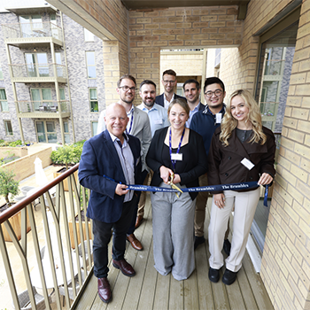 A group cutting the ribbon at The Brambles